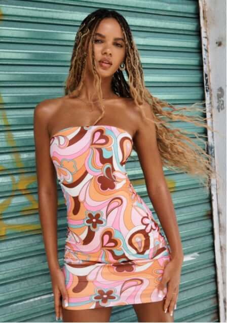 Model wearing summer dresses.