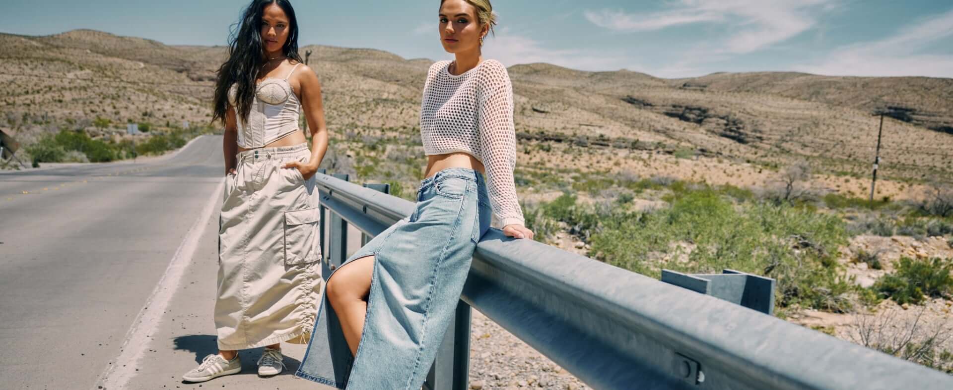 Models are wearing a cargo skirt, denim skirt, neutral crochet top, and bustier. 