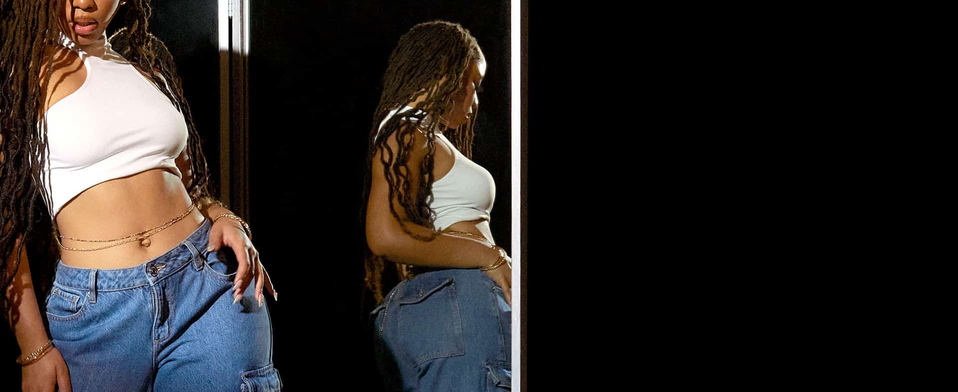 Closeup view of model wearing a white seamless top.