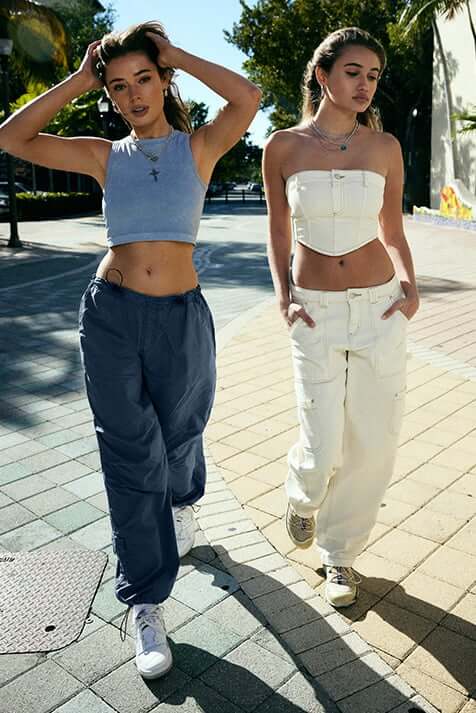 Models are wearing crops tops and oversized bottoms.