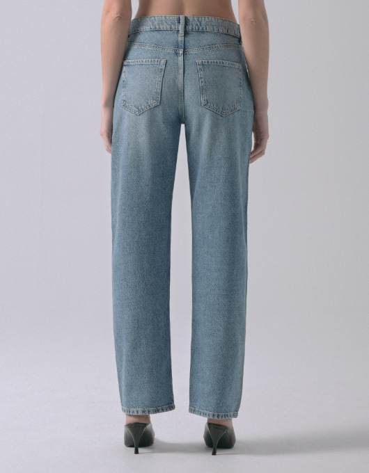 A model wears the Mika jeans - back view.