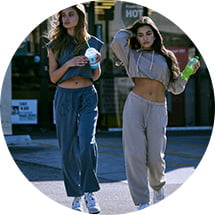 Models are wearing matching fleece sets.