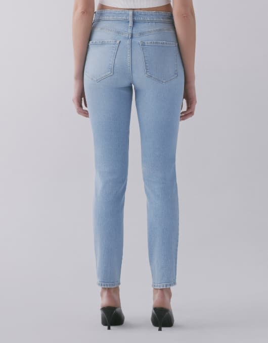 A model wears the Kate jeans - back view.