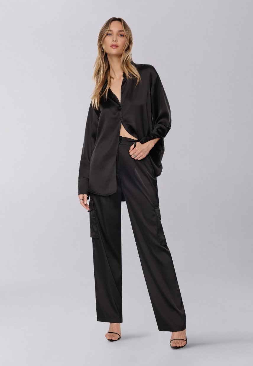 A model wears the Izabel satin straight-leg pants.